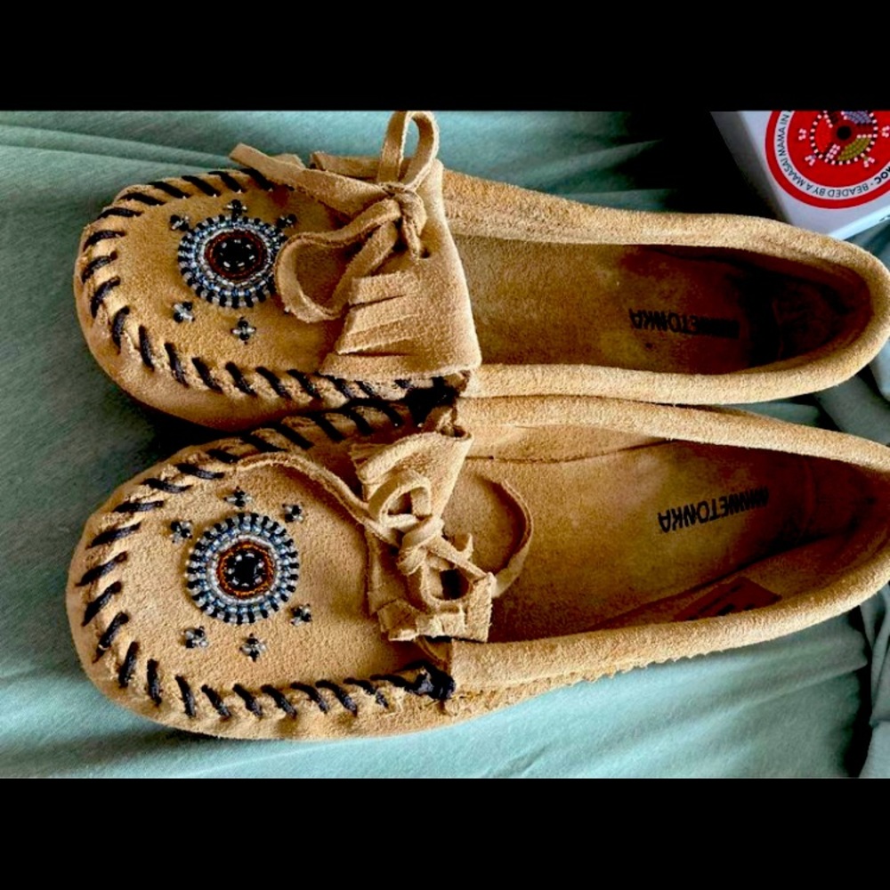 Brand new brown with beading Minnetonka moccasins.